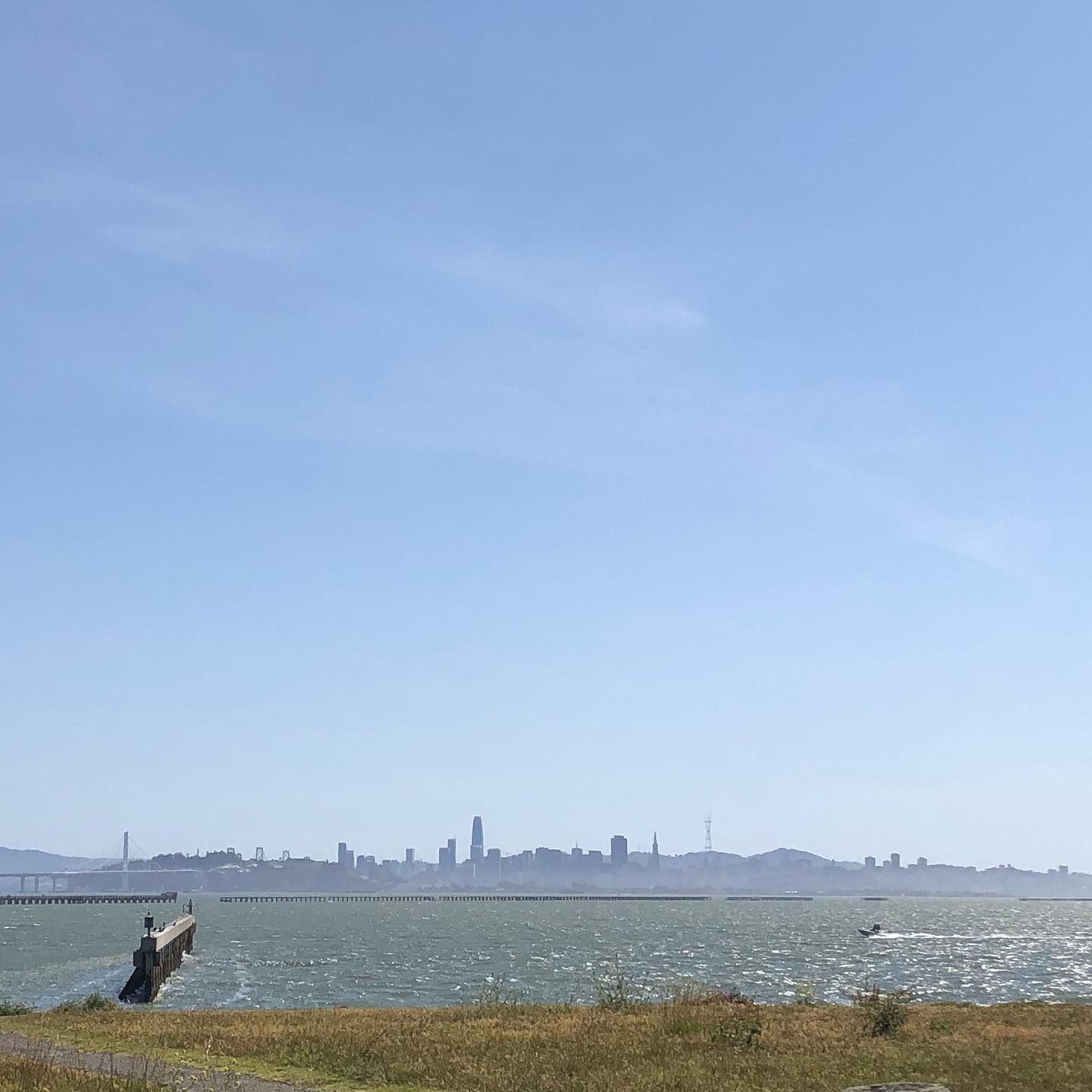 Are you the boat, the water, the bridge, the breakwater, the city, the wind, the waves, the grass or the sky?