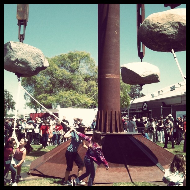 Children spinning 10,000 lb rocks