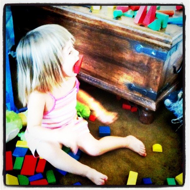 Emily eating her blocks