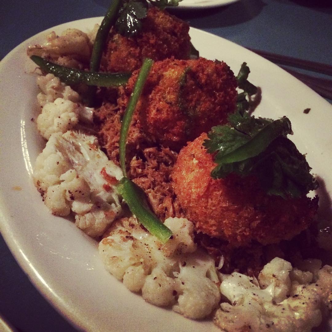 Fried macaroni and cheese on pulled pork with roasted cauliflower