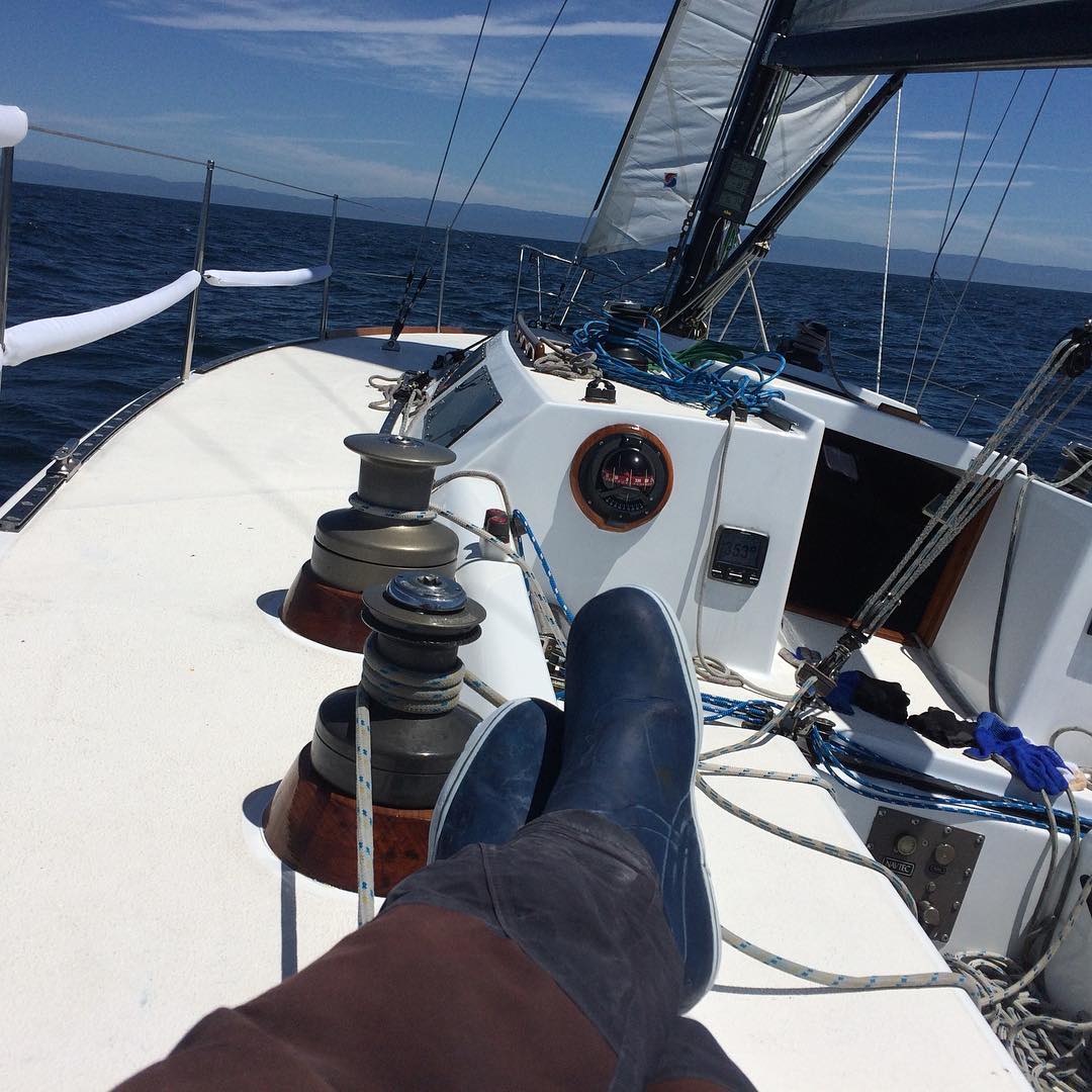 Making 5+ knots under sail with a perfect 12 knots of breeze to Santa Cruz. Shawn is taking a well deserved rest.