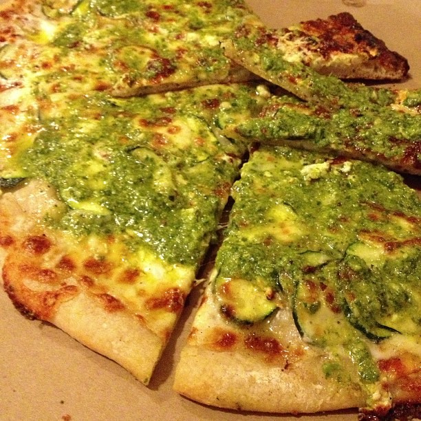What everyone is waiting for - zucchini, onions, French feta cheese, mozzarella, basil pesto and pine nuts. $10 for 1/2 pizza.